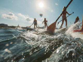 People paddleboarding on a sunny day with clear blue skies.